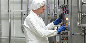 technician working at a control panel